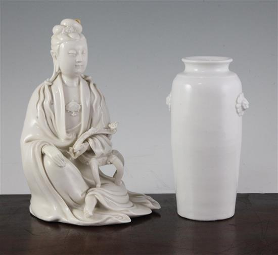 A Chinese Dehua blanc-de-chine seated figure of Guanyin and a similar vase, 17th/18th century,